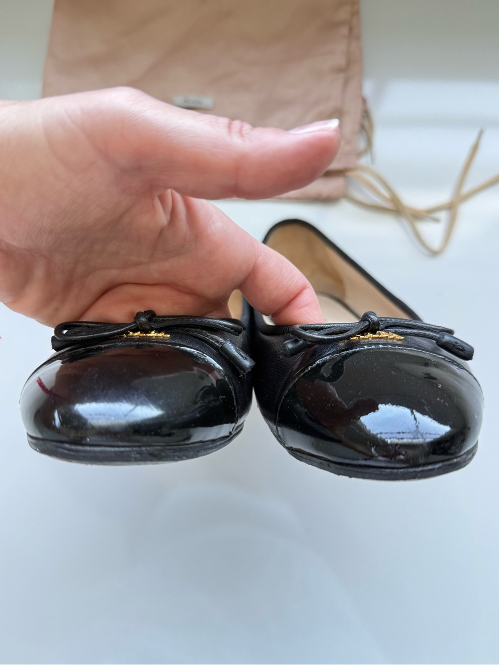 Prada Black Leather Ballet Flats with Patent Cap Toe and Bow - Picture 4 of 5